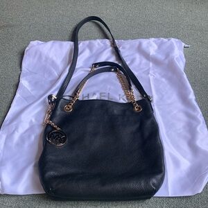 Michael Kors black shoulder or hand bag.